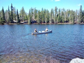 MNR fish stocking technicians Norm Hissa and Aron Causyn paddle across Emerson Lake to take brook trout to East Emerson Lake.
MNR photo