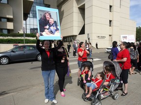 A rally for Geo Mounsef, a two-year-old boy killed when an SUV crashed into the busy resturant patio was held at the downtown courhouse in Edmonton, Alberta on Thursday, May 23, 2013.  Perry Mah/Edmonton Sun/QMIAgency