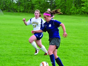 St. Mary Crusaders' Shondra Charbonneau charges upfield with the ball during the LGSSAA double-AA girls soccer final against St. Michael Mustangs on Thursday. Charbonneau had one of her team's two regulation-time goals in a 3-2 win that was decided on penalty kicks. (STEVE PETTIBONE The Recorder and Times)