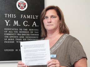 Sault Ste. Marie YMCA CEO Kim Caruso hold a copy of an e-mail blasting the facility's female-only swims.