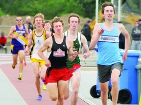 Craig Klomp of Stratford St. Michael, right, sprints to the finish line in the senior boys 1500 metres on Day 1 of the WOSSAA track and field championships in London Thursday. Patrick Deane of Dorchester, left, beat Klomp to the finish line by 6-100ths of a second. Cael Wishart of Stratford Central, background, was third. (Contributed photo)