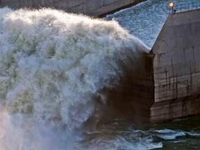 The Oldman Dam in the summer of 2013 during the June floods. Bryan Passifiume photo/QMI Agency.