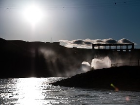 The view of the Oldman Dam and the spillway from a little ways down stream after a rainfall. The Oldman Dam was open to the public on Thursday, May 15. Bryan Passifiume photo/QMI Agency.