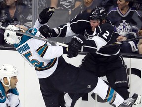 Kings defenceman Matt Greene hits Sharks forward James Sheppard during Game 5 of their NHL Western Conference semifinal at the Staples Center in Los Angeles, May 23, 2013. (LUCY NICHOLSON/Reuters)