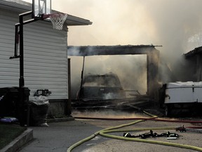 A fire destroyed one garage and caused serious damage to two others as well as home and utilities along Primrose Street on Thursday, May 16.