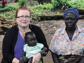 Ingrid May (left), president of the Agape Orphanage Foundation, during a visit to the group’s Malawi orphanage earlier this year.