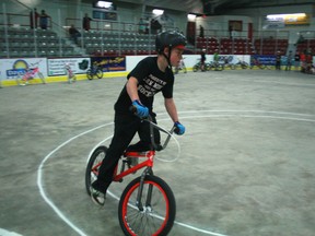 John Parnell peddles his bicycle around the figure 8 challenge during a tie-breaker race for first place at the Bike Rodeo on Friday, May 24 at the Kenora Recreation Centre. Parnell won the Grades 4 to 6 division earning himself a brand new bicycle.