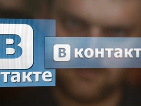 A man looks at a computer screen showing logos of Russian social network VKontakte in an office in Moscow May 24, 2013. REUTERS/SERGEI KARPUKHIN