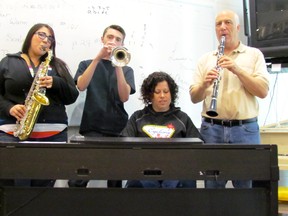 Tara Brennan, Lincoln Simpson, Denise Chaulk and Frank Brennan play a few riffs in advance of Saturday's St. Christopher Alumni Concert in Sarnia. (LIZ BERNIER, The Observer)