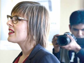 With University of Waterloo Master's in Digital Experience Innovation student Monaj Kelath videotaping her presentation, cross-Canada speaker Kadie Ward speaks to an audience at Stratford's train station Friday. (SCOTT WISHART, The Beacon Herald)