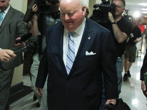 Senator Mike Duffy leaves the Senate at Parliament Hill in Ottawa May 9, 2013 after the Senate Board of Internal Economy.  (Andre Forget/QMI Agency)