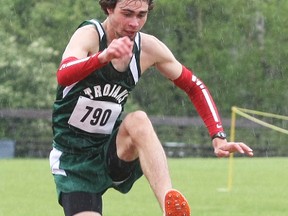 West Ferris Trojan Graham Hansel clears a steeplechase hurdle during the NDA championships at Northern Secondary School in Sturgeon Falls, Thursday. He broke two NDA records on the day, both set in 2007 by former West Ferris students Nick and Matt Walters.