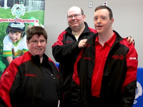 Special Olympians Leeann Bird, Ken Montroy and Brian Secker show off their new track suits at Kingston Police Headquarters on Friday.
Ian MacAlpine The Whig-Standard