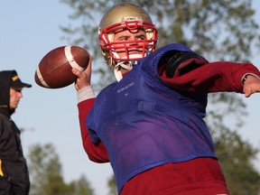 New Sarnia Imperials quarterback Ricky Gorton cocks the ball back for  pass during practice Friday, May 24, 2013 in Sarnia, Ont. (PAUL OWEN, The Observer)