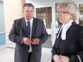 Cornwall Deputy fire Chief Robert Hickley, left, and his counsel, lawyer Fay Brunning, pause outside the Cornwall Courthouse after an adjournment in Hickley’s whistleblower case, on Friday.
Staff photo/GREG PEERENBOOM
