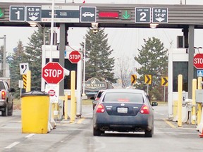 Cars check in at Cornwall’s customs booths at the foot of the international bridge.
File photo/CHERYL BRINK