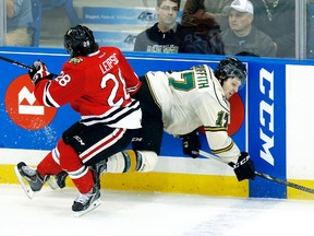 London Knights' Seth Griffith, right, of Wallaceburg is hit from behind by Portland Winterhawks' Brendan Leipsic for a penalty in the second period of the Memorial Cup semifinal Friday in Saskatoon. Griffith had one assist in the Knights' 2-1 loss. He is the Knights' all-time leading scorer at the Memorial Cup with nine points in two tournaments. The Winterhawks will play the Halifax Mooseheads in Sunday's final. (TODD KOROL/Reuters)