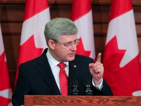 Prime Minister Stephen Harper speaks to his National Caucus at Parliament Hill in Ottawa, May 21, 2013. Andre Forget/QMI Agency