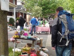 Shoppers peruse items on Melgund Ave. during the annual Glebe garage sale on May 25, 2013. The sale began in 1986 and attracts thousands each year. 
KELLY ROCHE/OTTAWA SUN/QMI AGENCY