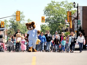 Dr. Beary Good leads several hundred children, adults and teddy bears on the annual Teddy Bear Parade down Main Street in Ridgetown Saturday. The parade and teddy bear picnic has a 23-year history in the southwestern Ontario town. DIANA MARTIN/ THE CHATHAM DAILY NEWS/ QMI AGENCY