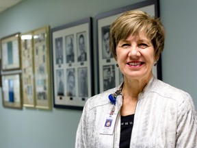 A history wall has been created at Bluewater Health's Charlotte Eleanor Englehart Hospital site in Petrolia, honouring the site's role in community health care. Site director Connie Courtney, also Bluewater Health's business director of rural health, is pictured with the wall. SUBMITTED PHOTO