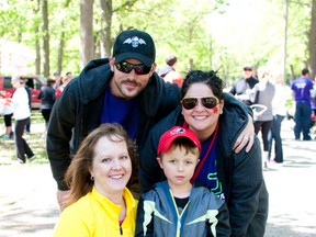 Organizer Lisa Headrick, back right,spearheaded Sarnia's first Walk for Muscular Dystrophy for her husband Ward, back left, and others struggling with the disorder in her community.  Jerrine Bowman, front left, and her son William, 7, were among the 100 or so participants who raised almost $22,000. NICKY MAXFIELD/SUBMITTED PHOTO.