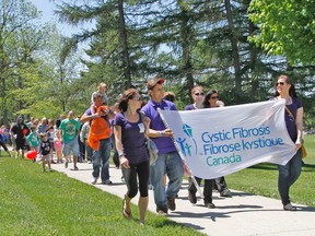 Participants in the annual Great Strides walk for cystic fibrosis head out for the three-kilometre hike around the Avon River Sunday, helping to raise more than $20,000 for research into the disease. MIKE BEITZ The Beacon Herald