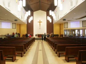 The curved pews inside the new Holy Trinity Catholic Church on Devonshire Avenue in Woodstock can accommodate up to 608 people. The newly constructed 23,000-square-foot church was dedicated during a mass on Sunday, May 26, 2013. JOHN TAPLEY/INGERSOLL TIMES/QMI AGENCY