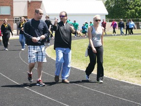 More than 500 people turned out to walk laps of the sports track at College Avenue Secondary School in Woodstock on Sunday, May 26, 2013, for the Time 2 Change Minds Walk-a-thon in honour of Tyler Maskell to raise awareness and funds in the fight against mental illness. The event was expected to generate $25,000 for several mental health programs and causes. JOHN TAPLEY/INGERSOLL TIMES/QMI AGENCY