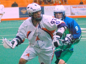 Johnny Powless of the Arrows eludes gets Kyle Killen of the Lakers during Ontario Junior A Lacrosse League action Sunday night at the Iroquois Lacrosse Arena. (DARRYL G. SMART, The Expositor)