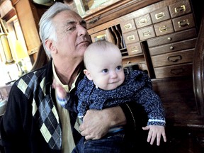 Barry Weiss, of Storage Wars fame, casts a discerning eye while nine-month-old Thatcher Warrener steals his thunder, during an interview Sunday May 26, 2013. Weiss spent the weekend in Chatham, On., as a special guest of Dan Warrener, Thatcher's grandfather, after wrapping up a cameo filming in Toronto for soon-to be-launched sitcom featuring Canadian funny man Dave Foley. DIANA MARTIN/ THE CHATHAM DAILY NEWS/ QMI AGENCY