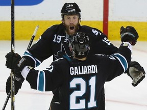 Sharks forward T.J. Galiardi celebrates a goal against the Kings with teammate Joe Thornton during Game 6 of their NHL Western Conference semifinal at HP Pavilion in San Jose, May 26, 2013. (JED JACOBSON/Reuters)