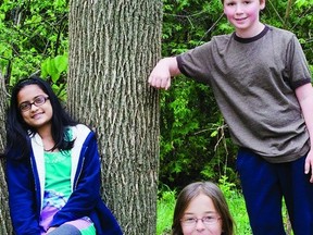 Wadaha Muhammed, Alicia Roy and Christian Mesheim (l-r) are Grade 6 Eco Leaders at Centennial Public School and members of the schools Eco Club. Recently, the club hosted an openhouse to showcase all they learned during the past year.      JULIA McKAY - KINGSTON THIS WEEK