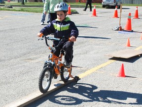 The Bike Rodeo was held at Huron Heights Public School on May 25, 2013 where youth could practice their bike safety. Kaiden Ford, age 8, practiced doing a figure-eight on his bike. (ALANNA RICE/KINCARDINE NEWS)