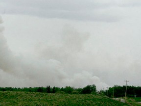 Smoke billows from a fire near Lindale on May 22. The fire blew out of control forcing the evacuation of nearby residents last week. Families were allowed back home on May 24 and the fire was declared 'under contol' on May 27.