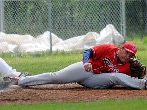 TERRY FARRELL/DAILY HERALD-TRIBUNE
Foremost Peaceland Peewee Red third baseman Lynden Testawitch stretches to catch the ball for the force out of Royals Blake Ulrich at third and the completion of a double play on Sunday.