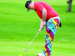 TERRY FARRELL/DAILY HERALD-TRIBUNE
Sean Tomkins sinks his putt for a round of 80. The Grande Prairie Golf and Country Club hosted the north qualifier for the Alberta Golf Association’s junior provincial championship Sunday. Tomkins was the low GP golfer and finished second overall.