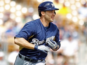 Milwaukee Brewers' Ryan Braun runs to first base on a deep fly ball against the Chicago White Sox during the first inning of their MLB Cactus League spring training baseball game in Glendale, Arizona, March 21, 2013. (REUTERS/Ralph D. Freso)