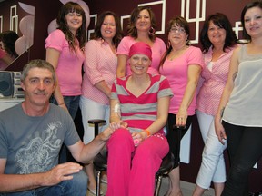 Lisa’s Hair Studio was filled with laughter and tears, as local hair and beauty salons got together to raise money for Lisa Froment, the 30-year-old mother of three diagnosed with breast cancer in January. Those surrounding Froment in the photograph are, from left, father Sylvain, Total Outlook’s Cindy St-Laurent, A Cut Above’s Sylvie Bellavance, Total Outlook’s Muriel Coté and Yvonne Groulx, and A Cut Above’s Diane and Sandra Jacques.