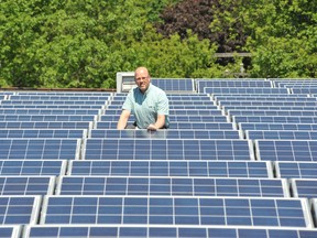 City operations director Conal Cosgrove poses amid the solar panel array on the roof of the Gord Watts Municipal Centre on Monday. RONALD ZAJAC The Recorder and Times