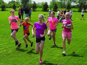 Thousand Islands Elementary students (l-r) Keira Macneil, Tori Senecal, Paige Kirkpatrick, Kaitlyn Nash and Trinity Hartley were just a few of the children who took part in the school's annual track and field competitions. Medals will be given to the top athletes at an awards ceremony later this school year.           Wayne Lowrie - Gananoque Reporter