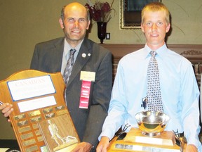 Paul Dodds and Kevin Haney hold their trophies after winning top senior plowman and top junior plowman at the Canadian Plowing Championships at Abbotsford, B.C. earlier this month.