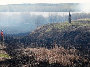 Timmins, Whitney and Schumacher fire halls responded to a brush fire behind the Whitney Arena on Tuesday afternoon. The fire, driven by strong southern winds and dry conditions spread quickly to the edge of Harold Avenue (Hwy. 101) before firefighters got control of the blaze. The smoke was visible throughout South Porcupine and from as far away as Dead Man's Point.