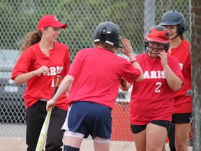 Jaime Emerson (2) high fives her teammates after hitting a three-run home run in a semi-final game against the North Park Collegiate Trojans, the Paris Panthers' final game of the season. NPC won the game 19-4 after three innings. MICHAEL PEELING/The Paris Star/QMI Agency