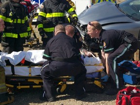 A woman is placed on a stretcher by Fairview EMS following a mock collision as part of a demonstration for the Prevent Alcohol and Risk-related Trauma in Youth (P.A.R.T.Y.) program on Thursday, May 23. The program took place at the Fairview Fire Hall. Daniele Alcinii/Fairview Post