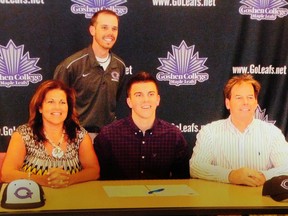 Preston Carr, 17, of Central Elgin is flanked by his mother, Kelly, and father, Steve, and backed by Goshen coach Alex Childers at the signing of his National Letter of Intent to play second base for the Maple Leafs. CONTRIBUTED