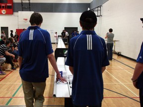 Students wait at the end of the 20 metre track during an exhibition challenge of the F1 in Schools junior and senior teams’ cars, Tuesday morning at Father Patrick Mercredi High School. AMANDA RICHARDSON/TODAY STAFF