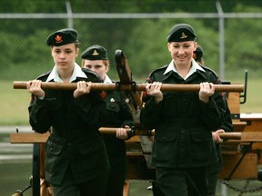 SARAH DOKTOR Times-Reformer
Cassidy Brook and Jordan Buck take part in a gunnery drill demonstration with a replica of an 1866 Armstrong 6 pounder field gun during the 44th annual Simcoe Army Cadet Corps review on Tuesday.