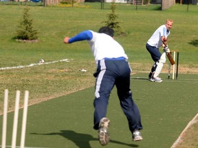 Batsman Jason Schembri keeps his eye on the approaching ball from bowler Devendera Saindane during a cricket match on Saturday. The Grande Prairie Cricket Association tested out its new permanent pitch at the North Ridge sports fields on 103 Street and 121 Avenue.
Terry Farrell/Daily Herald-Tribune