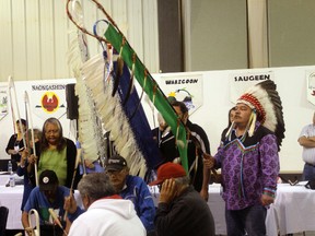 Treaty 3 Grand Chief Warren White (in head dress) takes part during the opening ceremonies of the Treaty 3 National Assembly being held in Northwest Angle this week.
ALAN S. HALE/Daily Miner and News